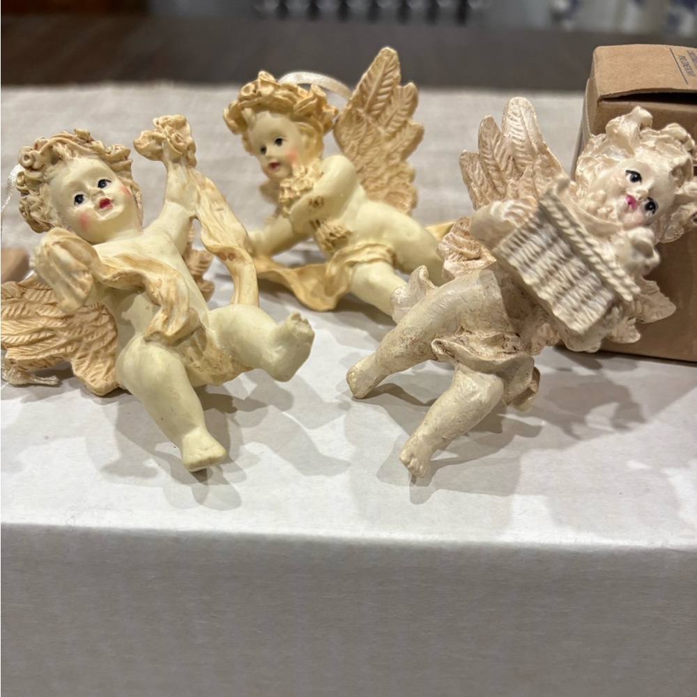 Cherub with fruit basket ornaments